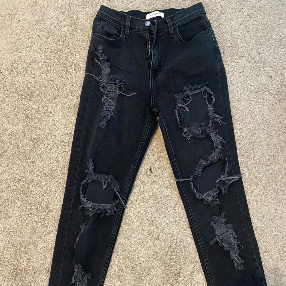 Black ripped jeans.